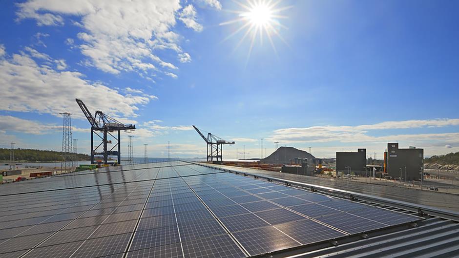 Solar cell system at Stockholm Norvik with two container cranes in the background