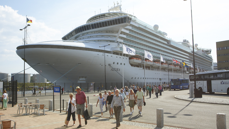 Cruise passengers beside the cruise vessel Azura in Frihamnen port