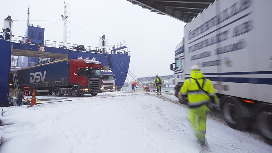 A truck rolls of a ferry at a snowy Port of Kapellskär