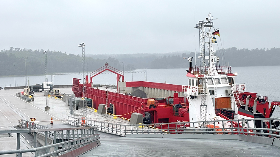 Barge for stone at the quay at Stockholm Norvik Port