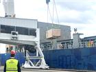 Deputy Harbour Master watches as cargo is unloaded from ship