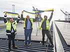 Thomas Andersson, Harry Bouveng and Fredrik Lindstål by the new solar cell facility at Stockholm Norvik