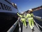 Two dock workers beside a vessel at Port of Kapellskär