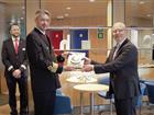 Johan Wallén handing over plaque to captain of Stena Scandica
