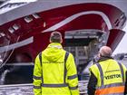 Two dock workers in front of Viking Glory