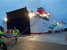 Two dock workers in front of Stena Flavia at Stockholm Norvik Port